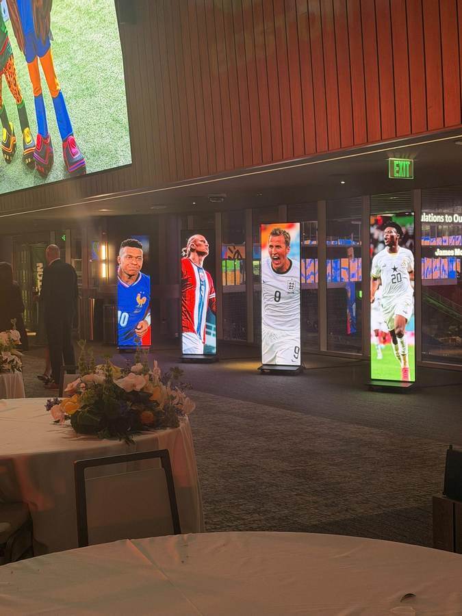Freestanding LED totems in an event foyer