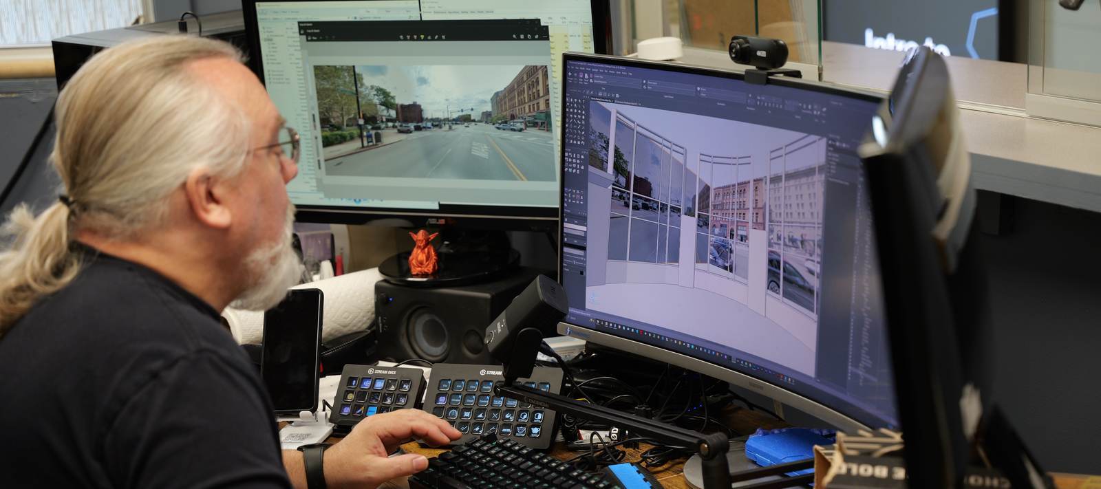 Designer building a 3D venue model on screen